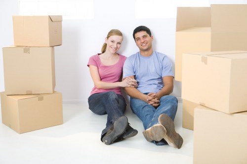 Commercial removals crew moving desks and IT equipment safely